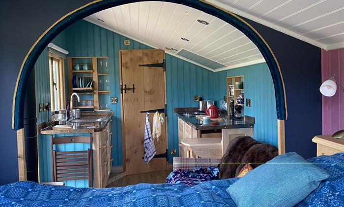 Unique cabin with wood burning stove, well equipped kitchen, ensuite bathroom and outdoor bath, super comfy king size bed, cozy sofa, sheepskin rugs a